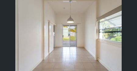 Well-Kept 3-Bedroom Home with Shed & Sunroom in Quiet Location - Photo 4