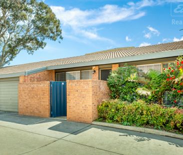 Fantastic Single Level Two Bedroom Townhouse with Garage - Photo 1