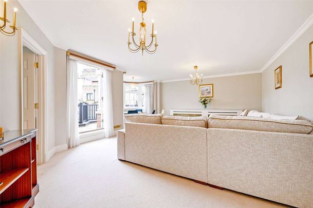 A first floor three bedroom apartment with large wrap around terrace and river views in a secure development with underground parking. - Photo 1