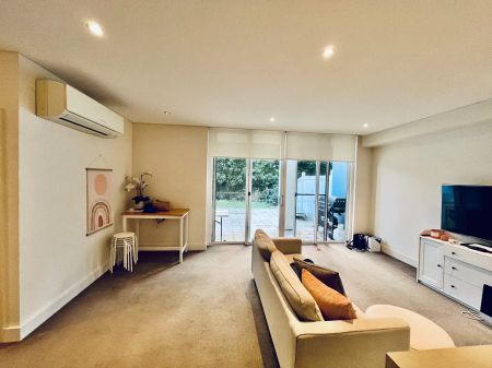 Stylish Apartment Living Surrounded by Waterfront Serenity - Photo 3
