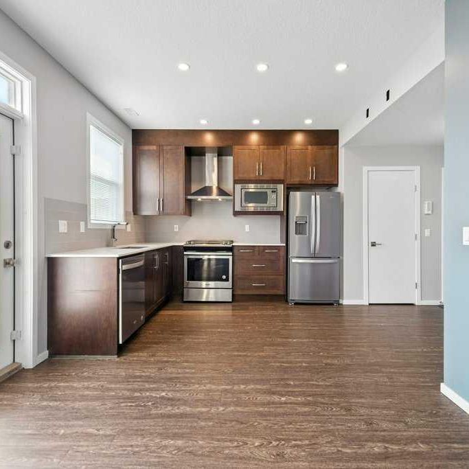 Quiet & Contemporary 3 Bed Townhouse | Close To Cross Iron Mall. Garage & A/C Included - Photo 1