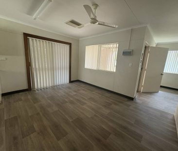 SPACIOUS FOUR BEDROOM, TWO BATHROOM HOUSE WITH 5X CARPORT - Photo 1