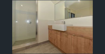 Modern Three-Bedroom Townhouse in a Sought-After Coastal Location- Break Lease! - Photo 4