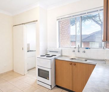 Sunlit, 2 bedroom residence with a lock up garage - Photo 2