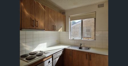 CONVENIENTLY LOCATED 2-BEDROOM UNIT FOR RENT - Photo 2