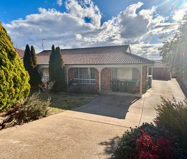 Bright Family Home with Sunroom and Outdoor Living Space - Photo 6
