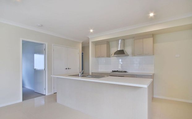Spacious Modern Home with Ducted AC & Garden Shed - Photo 1