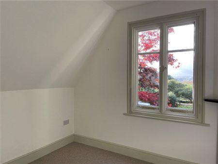 A sensitively modernised three bedroom cottage situated within a complex of Grade II listed buildings and adjoining the National Trust gardens with magnificent views towards the Carneddau mountain range. - Photo 3