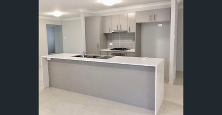 Freshly Updated Family Home in Highly Sought-After Morisset Park - Photo 4