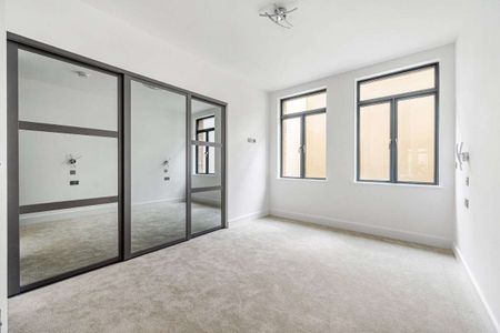 This stylish two bedroom apartment offers a contemporary living experience that combines comfort, convenience, and sophistication. - Photo 3