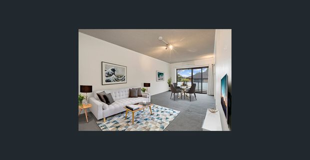 Spacious top floor unit with lock-up garage - Photo 1