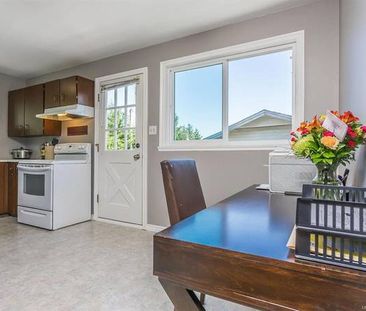 Upper Three Bedroom Suite with Laundry and Fenced Yard - Photo 1