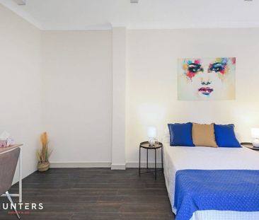 This large brick Duplex is perfect for the entertaining family - Photo 2