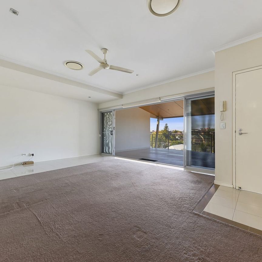 Top-Floor Living with Expansive Entertainer’s Balcony & City-Fringe Convenience - Photo 1