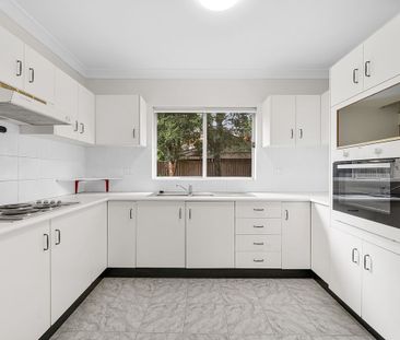 Dual level townhome in a quiet location- close to buses, park and l... - Photo 3