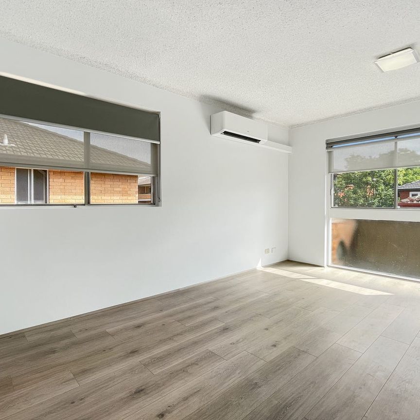 Newly Renovated | Modern Top Floor, 2 Bedroom Unit with Garage - Photo 1