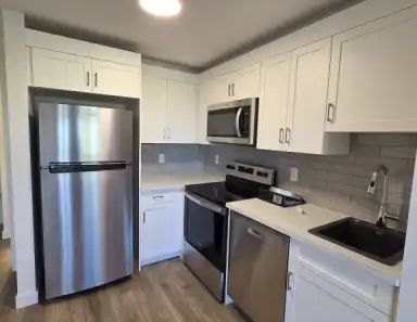 New Legal suite in Alpine Park/Vermilion Hill | 84 Versant Point Southwest, Calgary - Photo 1