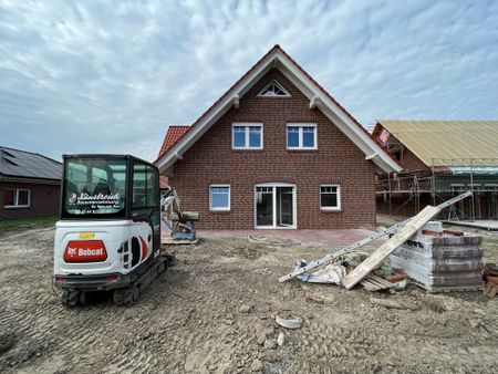 Neubauwohnung im Erdgeschoss mit großer Garage und Garten - Foto 2