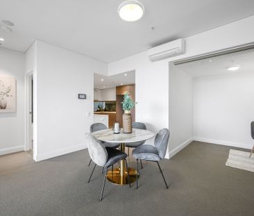 Contemporary Two-Bedroom Offering Breathtaking Water & City Views i... - Photo 6