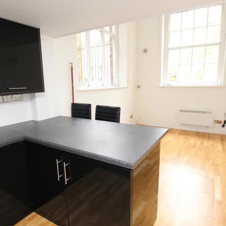 A spacious apartment in a unique historical building with an excellent central location near Cabot Circus. Call today for a viewing! - Photo 1