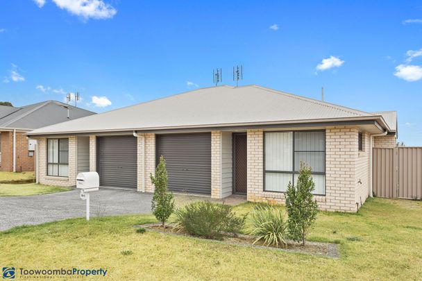 This impeccably presented lowset brick unit is sure to impress! - Photo 1