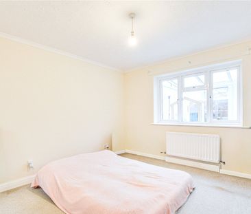 A 2 bedroom detached bungalow with a garage and driveway parking in... - Photo 5