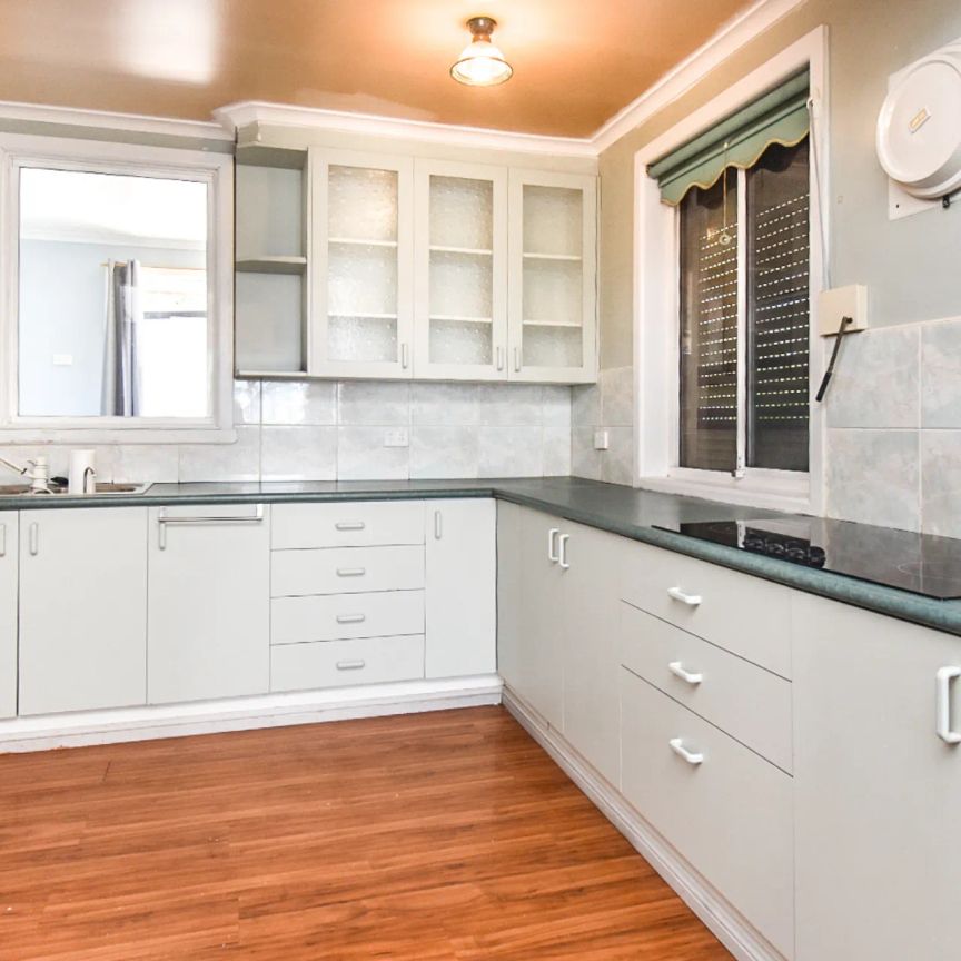 Three-Bedroom Home with Secure Yard - Photo 1