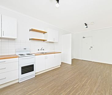 Conveniently Located with a Lock-Up Garage - Photo 1