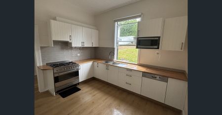 Fully Renovated Coastal-Inspired Home Just Minutes from the Beach - Photo 5