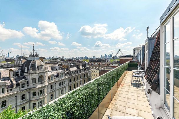 A beautifully presented two-bedroom penthouse apartment in a well-maintained building with a roof terrace and 24 hour porter. - Photo 1