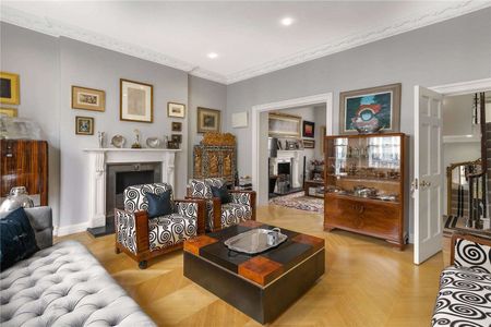 A 'key' Grade II listed part stucco fronted house, located just off Onslow Gardens. - Photo 2