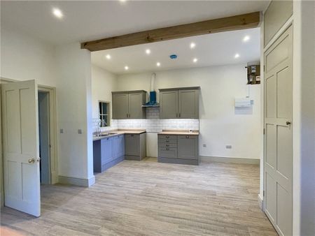 A sensitively modernised three bedroom cottage situated within a complex of Grade II listed buildings and adjoining the National Trust gardens with magnificent views towards the Carneddau mountain range. - Photo 4