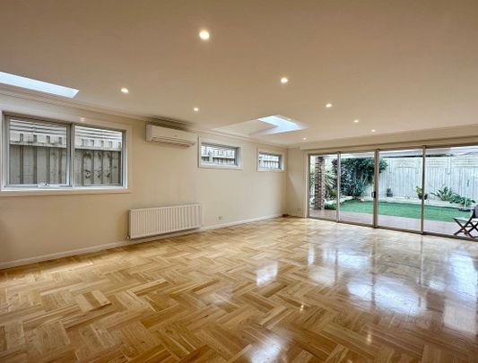 ARCHITECTURALLY DESIGNED TOWNHOUSE IN THE MCKINNON SCHOOL ZONE - Photo 1