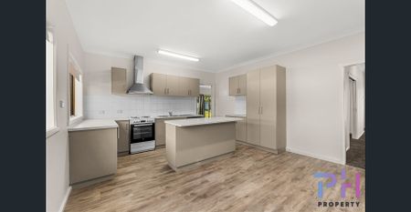 A REFRESHED FOUR BEDROOM HOME AWAITS YOU! - Photo 2