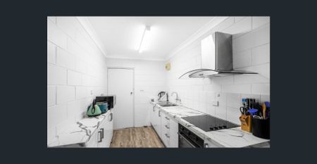 Two Bedroom Unit - tidy and modern kitchen - Photo 4