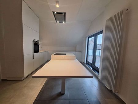 Modern en energiezuinig 2-slaapkamerappartement met carport en ruim terras. - Photo 5