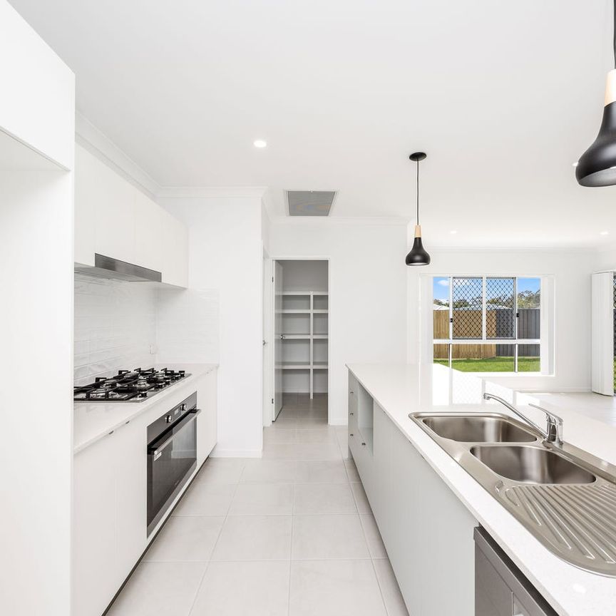 Near New Four-Bedroom Home with Ducted A/C & Media Room - Photo 1