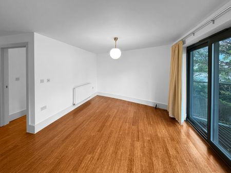 Situated along the High Street overlooking a private communal garden, this modern 2 bedroom flat offers a large balcony, open plan living/dining/kitchen area and allocated parking. - Photo 3