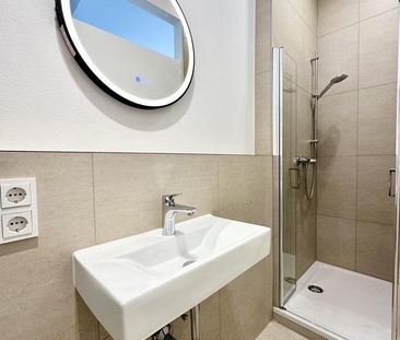 Erstbezug nach Kernsanierung: Moderne 1,5-Zi.-EG-Wohnung mit Küchen... - Photo 1