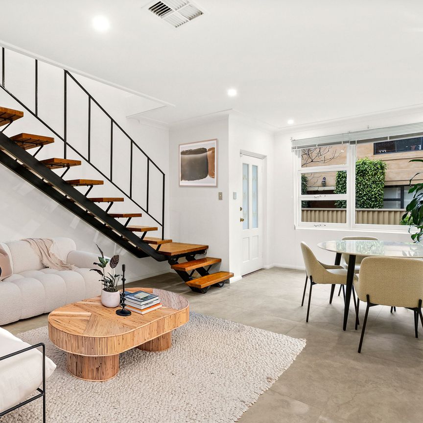 Dual-Level Townhouse In An Ideal Location - Photo 1