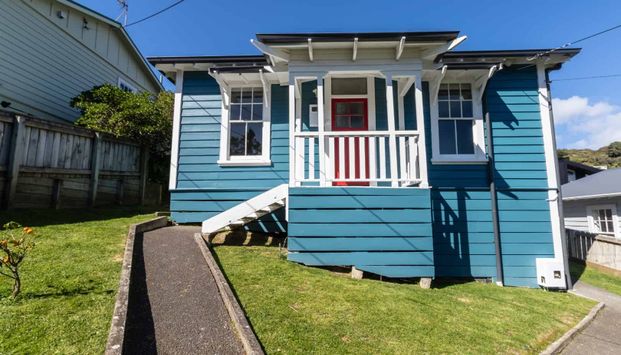 Charming Three-Bedroom Home - Photo 1