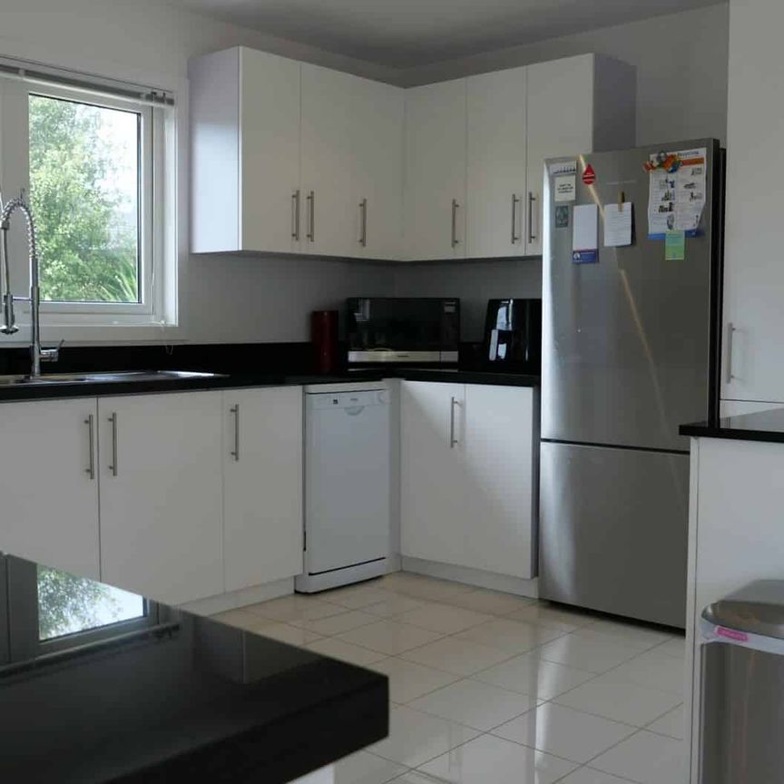 Stylish Three-Bedroom German-Engineered Home - Photo 1