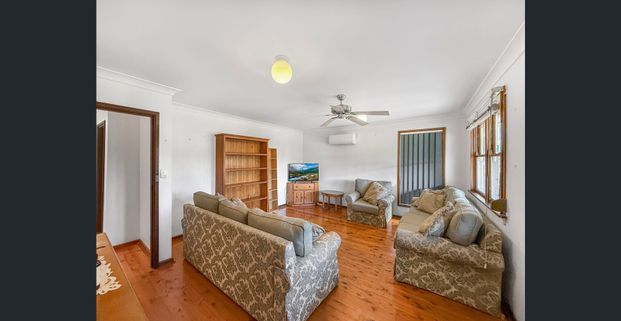 DECEPTIVELY SPACIOUS AND IN PRIME LOCATION! - Photo 1