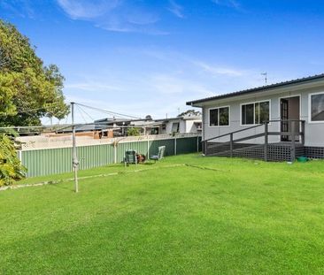 Family home with multiple living zones and large fenced yard - Photo 1