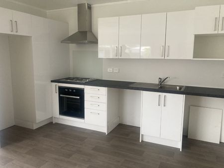 This new, two bedroom home is tucked down a long driveway, surrounded by trees and greenery and offers both a garden shed and a convenient carport. - Photo 4