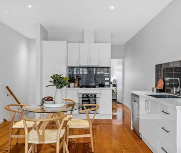 Spacious Two-Bedroom Design with Private Bathrooms - Photo 1