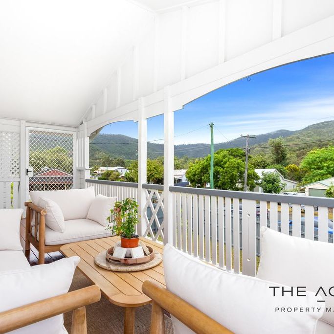 Stunning Queenslander with Modern Comforts and Spacious Outdoor Living! - Photo 1