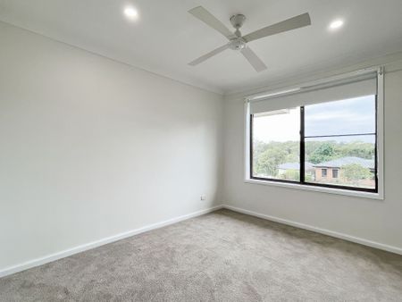 Renovated 3-Bedroom Home with Double Garage & Multiple Living Areas - Photo 4