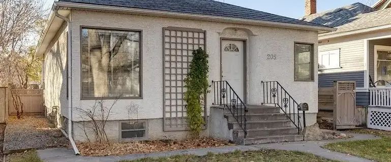 Bright and Airy Renovated Balmoral Bungalo With Large Fenced Yard | 205 19 Avenue Northwest, Calgary - Photo 1