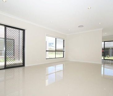 Spacious Modern Home with Ducted AC & Garden Shed - Photo 6